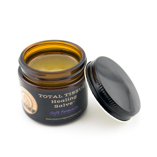 Open jar of Total Tissue Healing Salve™ Soft Formula on a clean white background